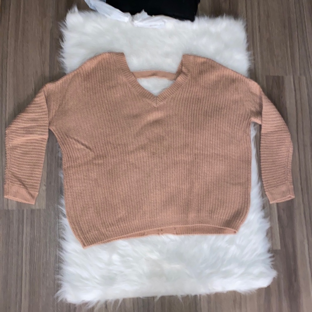 NEW without tags never worn open v-neck back baggy sweater.